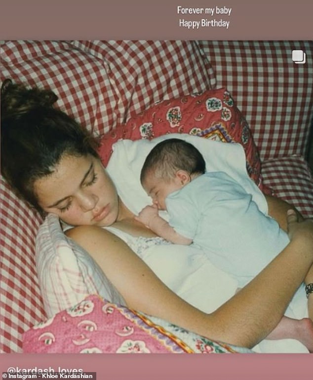 Meanwhile Khloe uploaded a picture of herself cradling baby Kylie, writing: 'Forever my baby,' and adding: 'Happy Birthday'