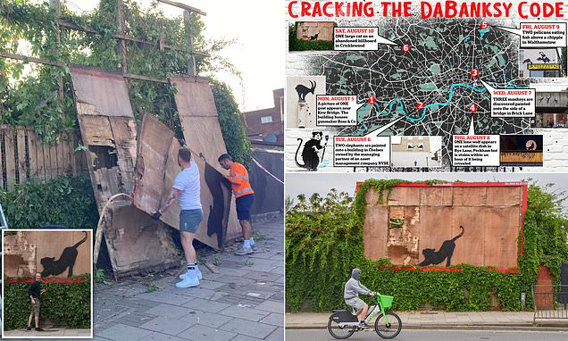 Locals boo as Banksy's new cat artwork is 'taken down' amid fears it 'could be thrown in a