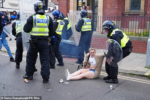 The crackdown on rioters has been swift. Pictured is Stacey Vint, who has been jailed for 20 months after pushing a wheelie bin at police and falling over in the process