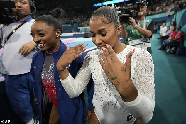 Jordan Chiles (right) reacts to winning the bronze medal as teammate and silver medalist Simone Biles smiles next to her