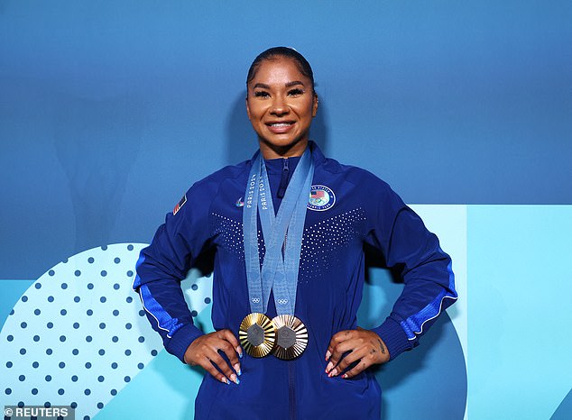 Chiles poses with her bronze and gold medal which she also won as part of Team USA during the team gymnastics competition