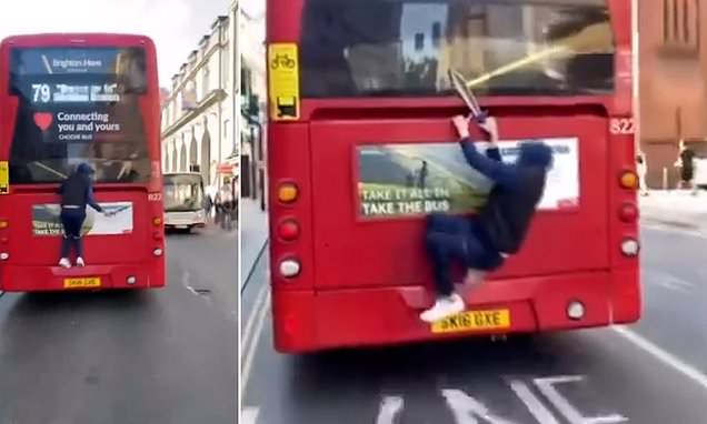 Shocking moment youth armed with a large knife clings to the back of a double-decker bus