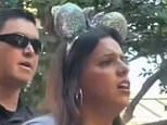 Mother is escorted out of Disneyland in handcuffs with crying children clinging on after common ploy to sneak kids into theme park backfired