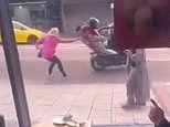 Heroic moment woman foils e-bike thieves by yanking one off back of moped as they try to ride off with it