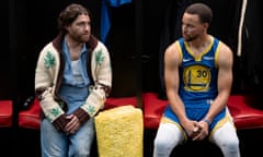 Two men, one wearing a Golden State Warriors basketball uniform, sit in a gymnasium