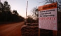 A warning sign at the entrance to the farm in White River.