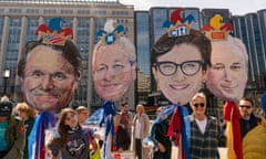 Activists hold likenesses of bank CEO's during a "Stop Dirty Banks," rally and protest, Tuesday, March 21, 2023, in Washington.(AP Photo/Alex Brandon)