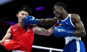 Japan’s Shudai Harada (left) feels the force of a big right hand from Colombia’s Yilmar Leandro Gonzalez Landazury