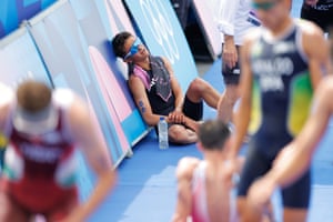 Alex Yee collapses in exhaustion after winning gold in the men’s individual triathlon