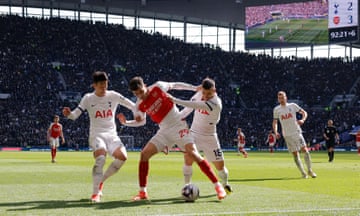 Arsenal's Kai Havertz shields the ball from Son Heung-min and Giovanni Lo Celso of Tottenham