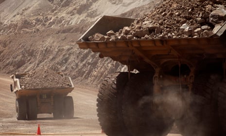 Mining trucks travel along a road at Chile's Esperanza copper mine near Calama town, about 1,025 miles north of Santiago.