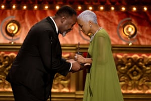 Kara Young accepts the award for best performance by an actress in a featured role in a play for Purlie Victorious: A Non-Confederate Romp Through the Cotton Patch from actor Wendell Pierce