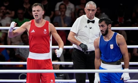 Britain's Lewis Richardson celebrates after defeating Serbia's Vakhid Abbasov in their men's 71 kg preliminary boxing match.