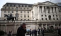 People outside the Bank of England in the City of London’s financial district in London.