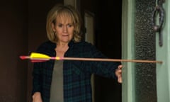 LORRAINE ASHBOURNE in Sherwood, looking at an arrow in the door