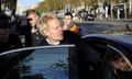 Mike Jeffries, seen in profile, getting into a car on the Champs-Elysees in Paris in 2012