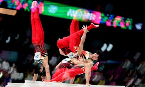 A multiple exposure of Shinnosuke Oka of Japan performing on the parallel bars during the men’s all-around final.