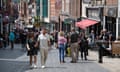 People out walking and standing around talking on a busy shopping street in Windsor