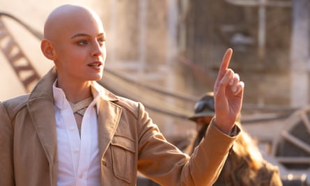 bald woman with finger outstretched