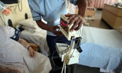 A nurse tends to recovering patients on a general ward at the Queen Elizabeth hospital in Birmingham