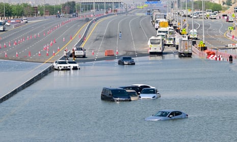 People use kayaks to rescue stranded residents after the heaviest rainfall in the United Arab Emirates in 75 years