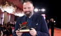 Poor Things’ director Yorgos Lanthimos poses with Venice’s Golden Lion award.