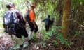 Cat Walk guide Adi and Mycat conservation officer Hairiel Muhamad Nor lead the group though the forest  in Malaysia’s Sungai Yu ecological corridor