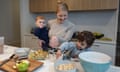 Andrea Hipsher with children Levi, 3, and Jonah, 11 months, preparing food in the kitchen