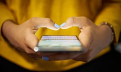 Young woman using mobile phone to send text message