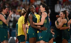 Marianna Tolo hugs Ezi Magbegor after Australia won the women's bronze medal basketball match against Belgium at Bercy Arena in Paris.