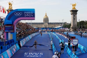 Cassandre Beaugrand of France crosses the line to win gold in the women’s individual triathlon