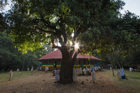 People gather early on a Sunday morning at Robit Bahita church