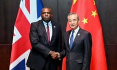 China's foreign minister Wang Yi shakes hands with Britain's foreign secretary David Lammy during a ministerial meeting of the Association of Southeast Asian Nations