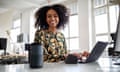 Woman using smart speaker while working in office.