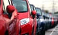 Red and blue cars parked in a row