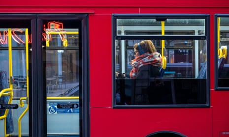 passenger on a bus wearing headphones