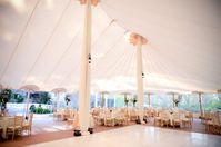 Spring tent wedding with white dance floor, white drapes, and gold chiavari chairs. Willowdale Estate, a weddings and events venue north of Boston, Massachusetts. WillowdaleEstate.com | Bharat Parmar Photography