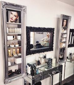 there is a mirror and shelves in the room with makeup products on display next to it