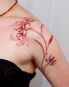 a woman with a tattoo on her shoulder