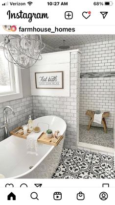 a white bath tub sitting in a bathroom next to a window