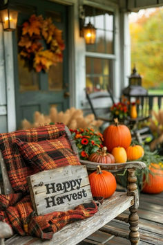 a wooden bench sitting on top of a porch filled with pumpkins and other decorations