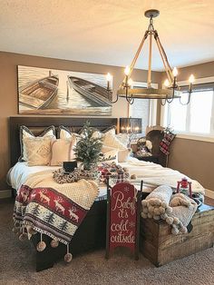 a bed room with a neatly made bed and christmas decorations