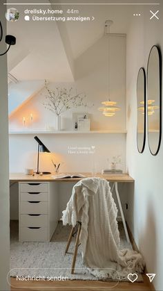 an image of a room with white furniture and lights on the ceiling, in front of a window