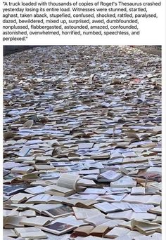 a large amount of books that are laying on the ground with words written in them