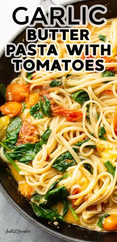 garlic butter pasta with tomatoes and spinach in a skillet