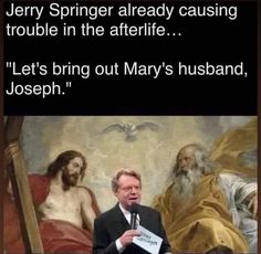 a man standing in front of a painting holding a sign that says, jerry to god you are not the father