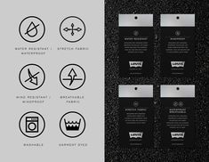 some black and white business cards with different symbols on them, all in one place