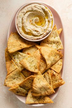 tortilla chips and dip on a plate