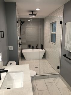 a bathroom with two sinks and a bathtub