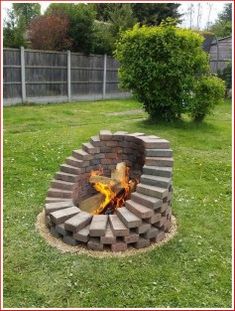 a fire pit in the middle of a yard